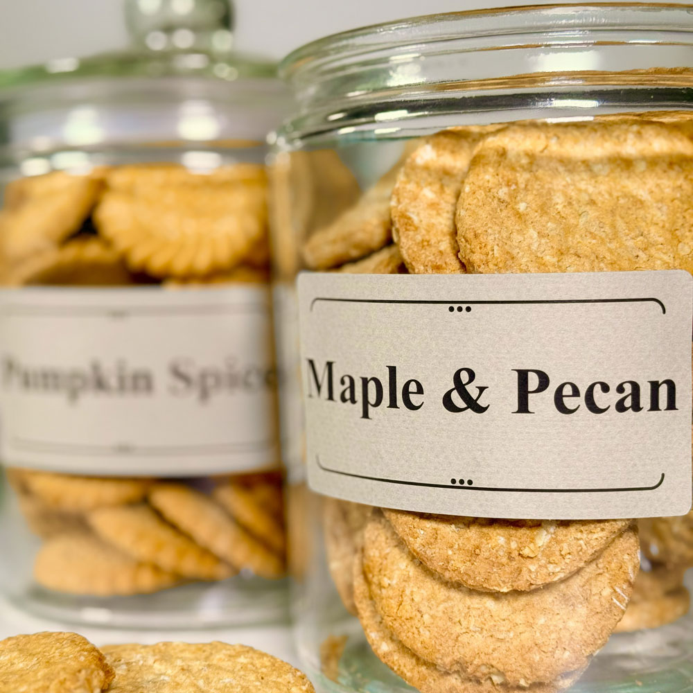 Picture showing cookie jars labelled with the flavors pumpkin spice and maple and pecan