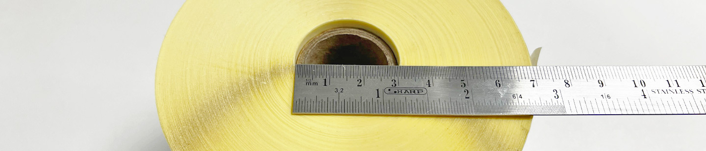 Image of a roll label showing a ruler measuring a core size