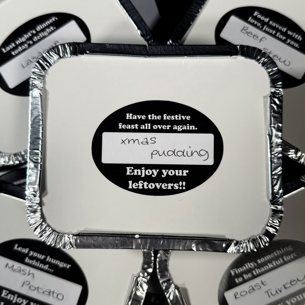 Picture showing label on a foil takeaway tub containing leftovers of xmas pudding